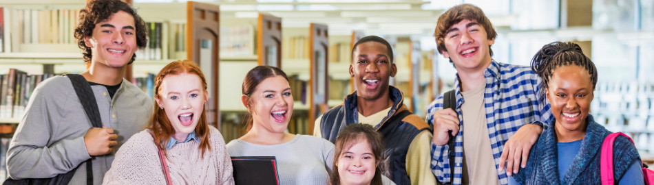 High school students socializing together with a downs syndrome student